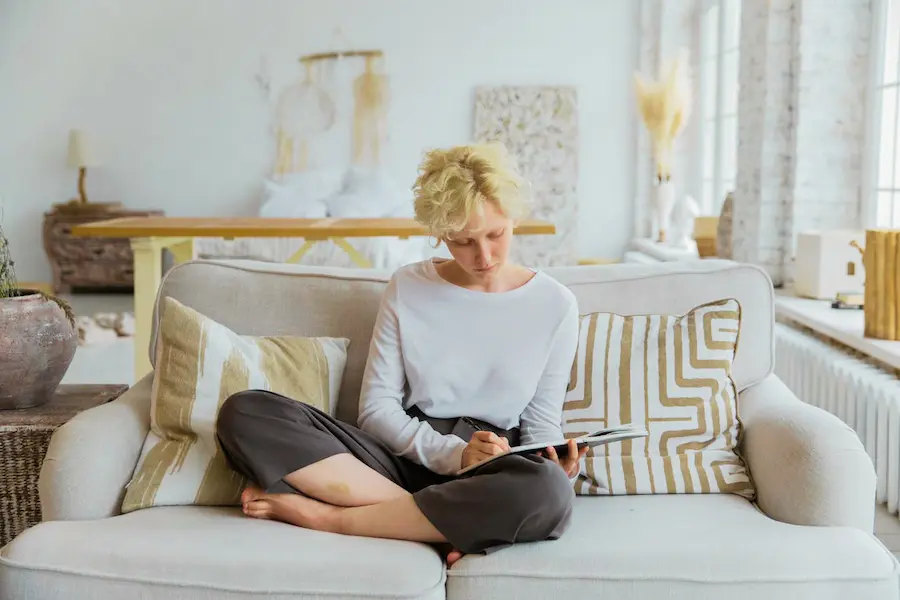 woman journaling for stress relief in a calm morning routine